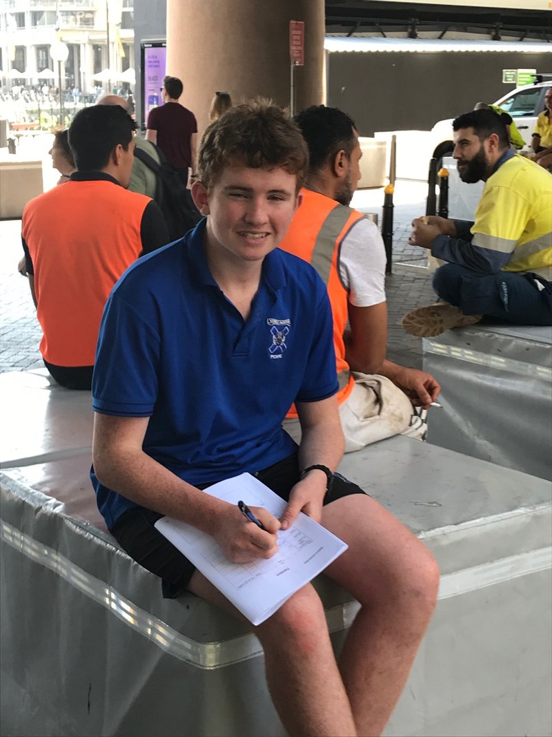 Felix Mole completing his fieldwork report at Circular Quay