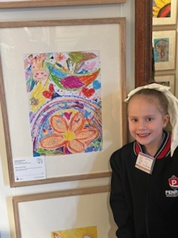 Isabella with her artwork at Fairfield City Museum and Gallery
